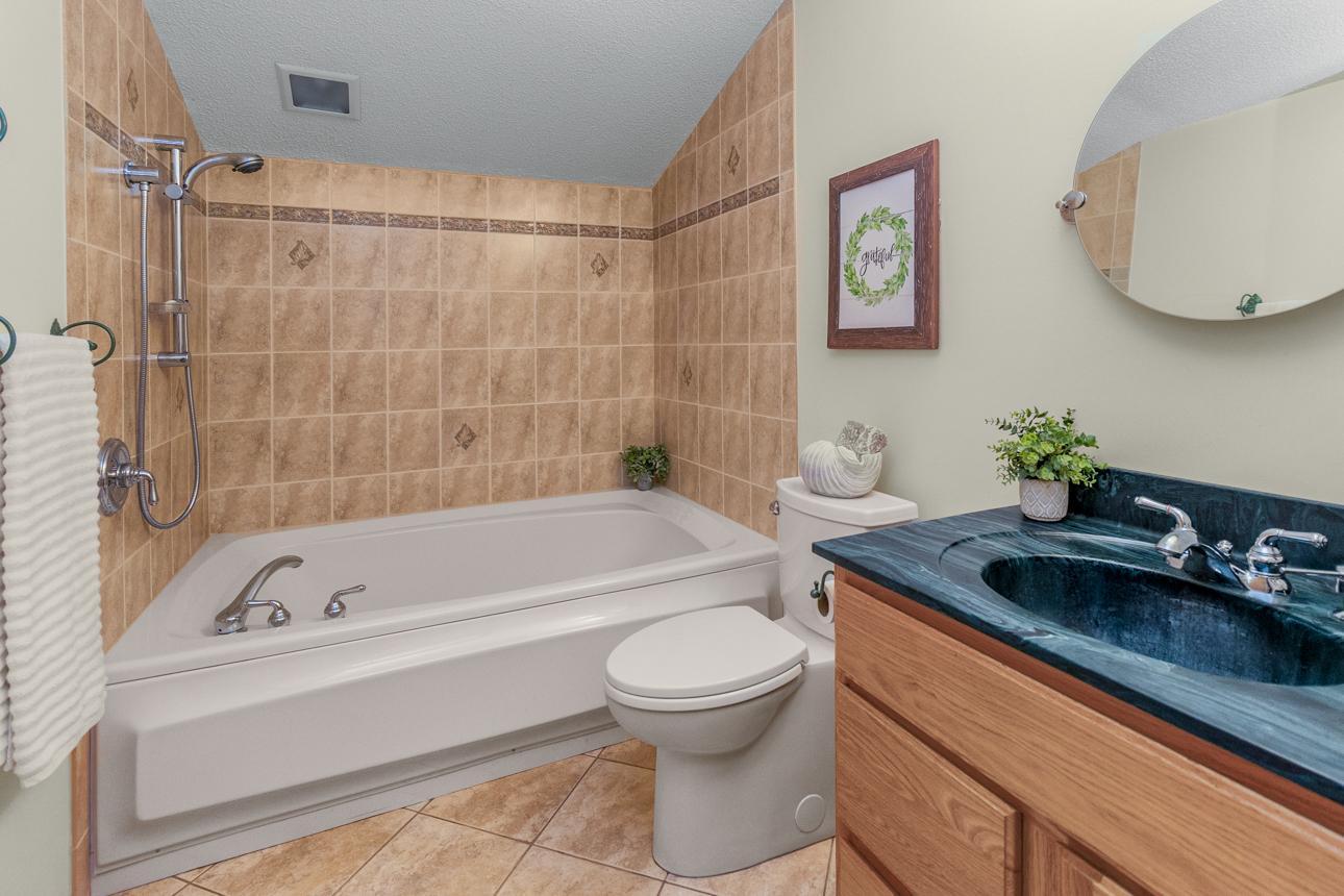 Lower level full bath includes oversized tub for the ultimate spa experience.
