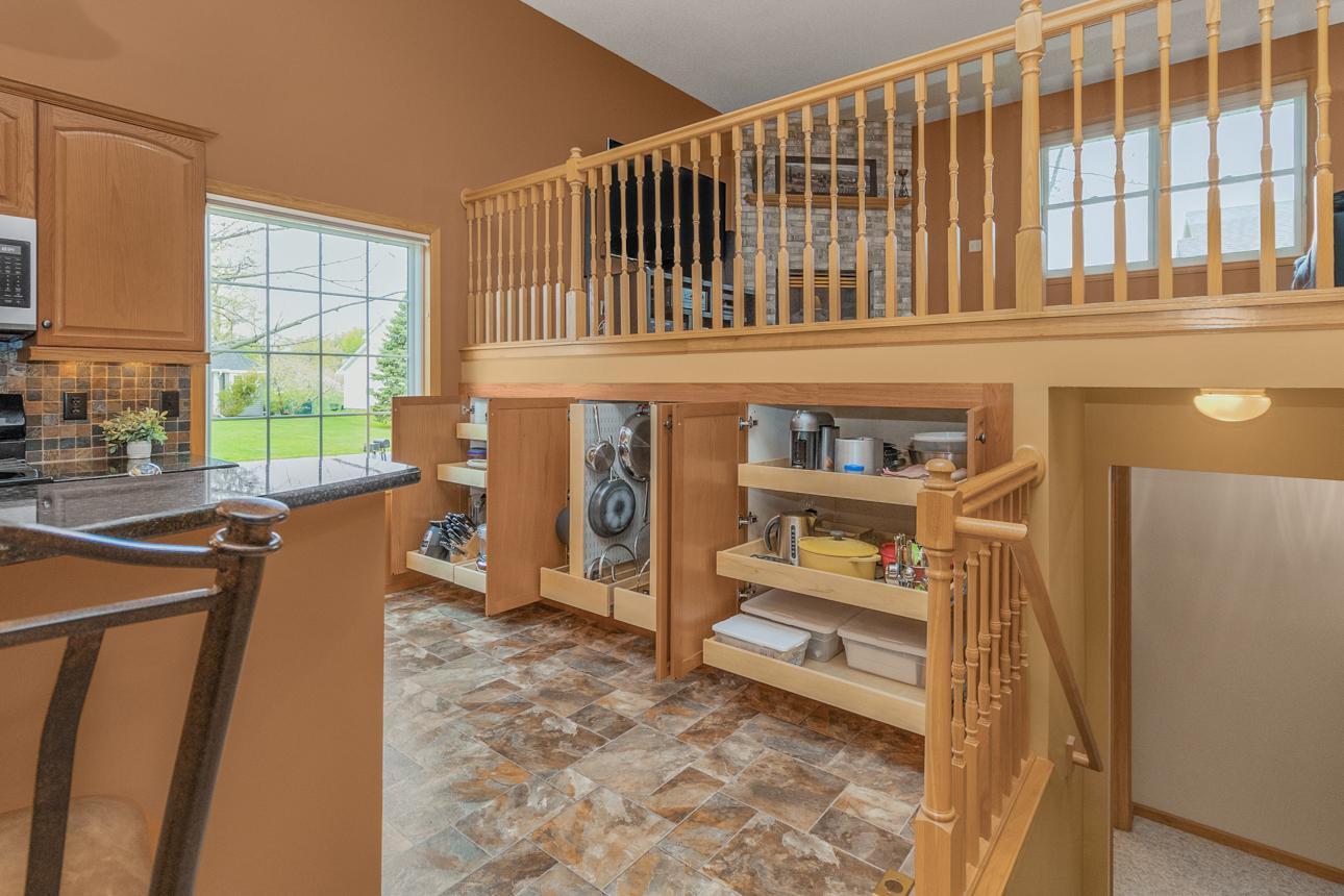 How clever! Custom pull-out storage for pots, pans, even a designated space for your stand mixer. Down to every detail, this home is so thoughtfully and brilliantly designed.