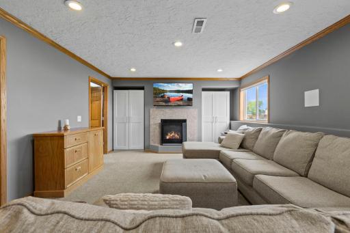 Extra closet space flanks both sides of the fireplace for added storage and convenience