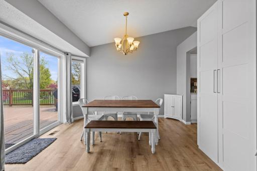 Open dining room leads out to the deck for easy indoor/outdoor dining
