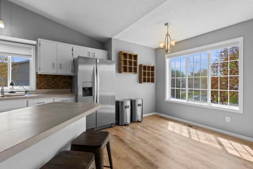 Light flows in through the window, creating a bright nook perfect for a small table and casual in-kitchen meals