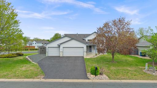 3 car garage with convenient 4th parking pad plus a storage shed, providing plenty of extra space for parking and all your outdoor essentials