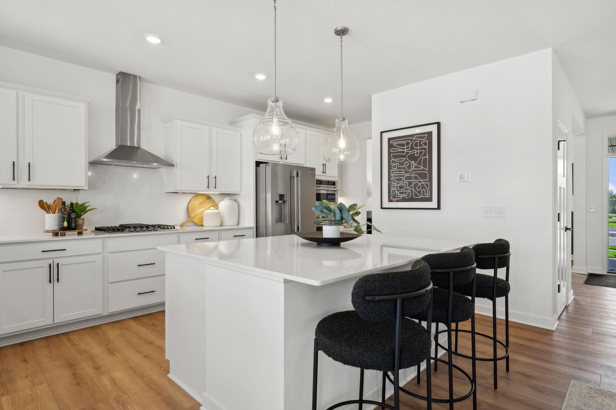 (Photo of a decorated model, actual homes finishes will vary) Entertain in this beautiful Gourmet Kitchen.