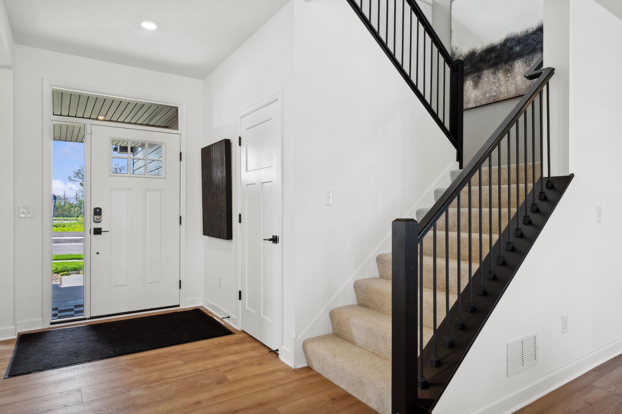 (Photo of a decorated model, actual homes finishes will vary) Make the best first impression with the bright and open foyer.