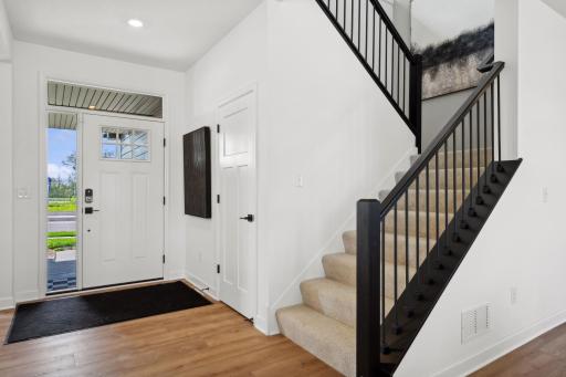 (Photo of a decorated model, actual homes finishes will vary) Make the best first impression with the bright and open foyer.