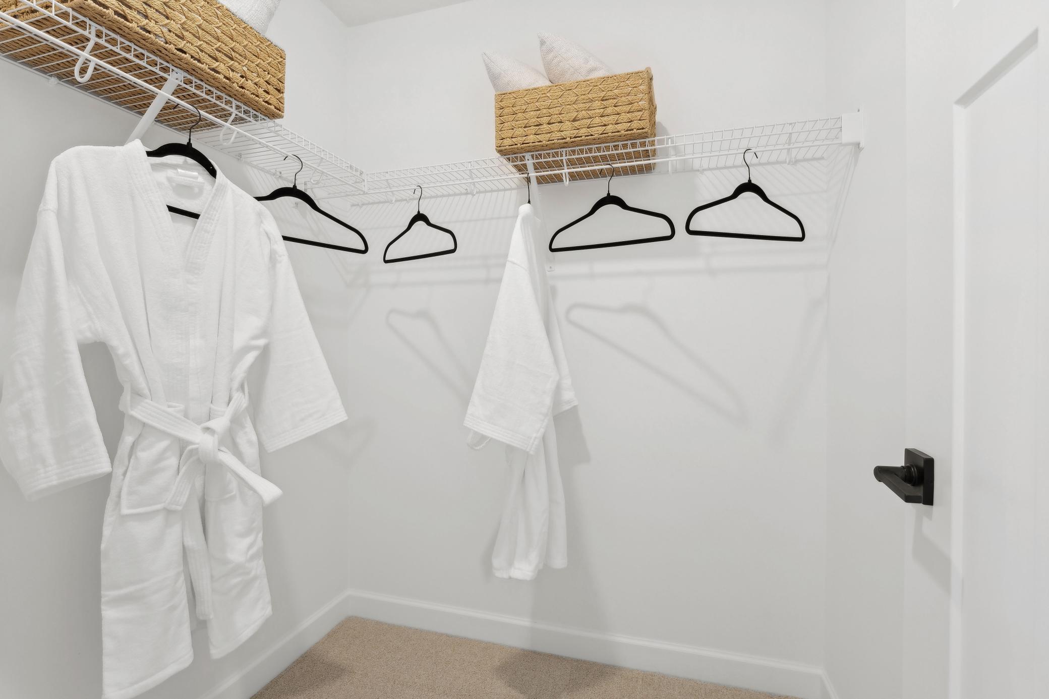 (Photo of a decorated model, actual homes finishes will vary) The primary bedroom features a walk-in closet.