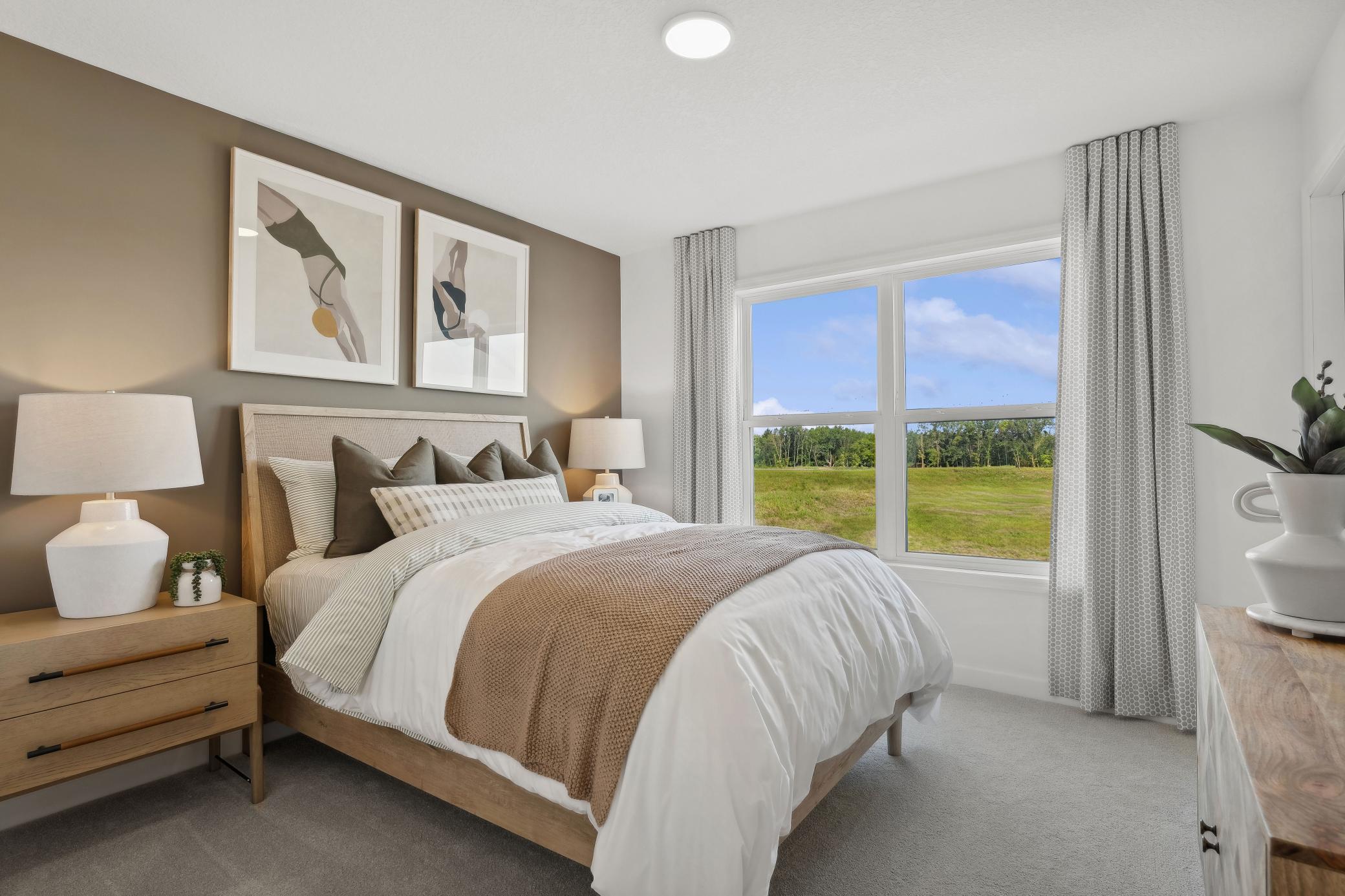 (Photo of a decorated model, actual homes finishes will vary) Another secondary bedroom on the upper level.