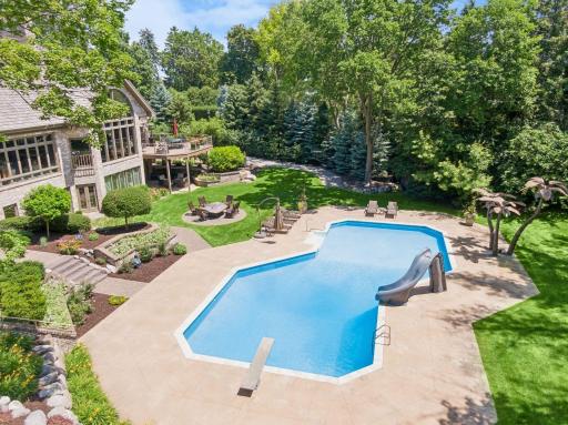 Below ground heated pool, slide, diving board.