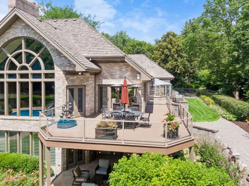 Maintenance free deck with private views of the pool, tennis court, and room to run and play.