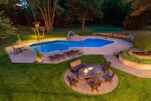 Below ground heated pool, slide, diving board.