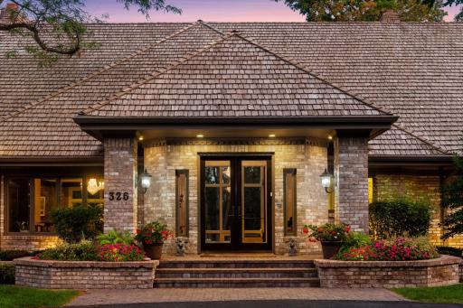 Stunning entryway with manicured landscaping