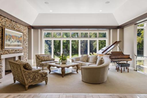 Step into the living room with expansive views of the backyard