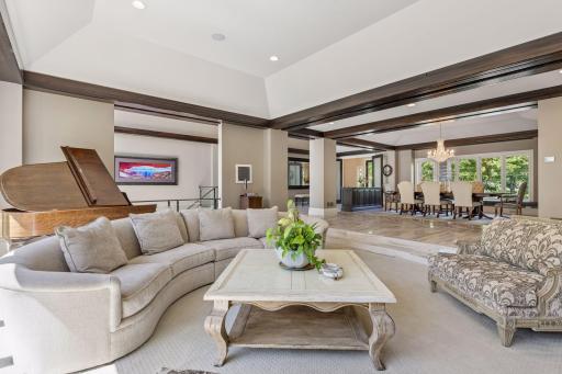 Vaulted ceilings, open floor plan, and beam accents