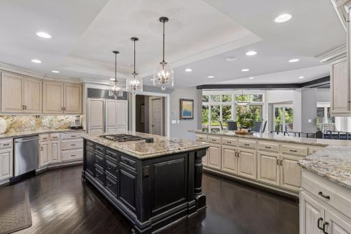 Beautiful ceiling details, two toned cabinets, and plenty of counter and cabinet space.