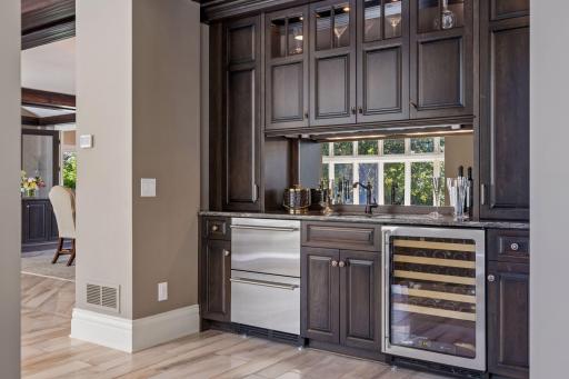Wet bar added in 2015 with wine cooler, new cabinetry, beverage fridge, and plenty of cabinet space.