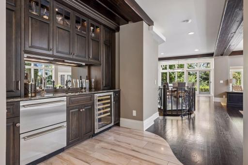 Wet bar added in 2015 with wine cooler, new cabinetry, beverage fridge, and plenty of cabinet space.