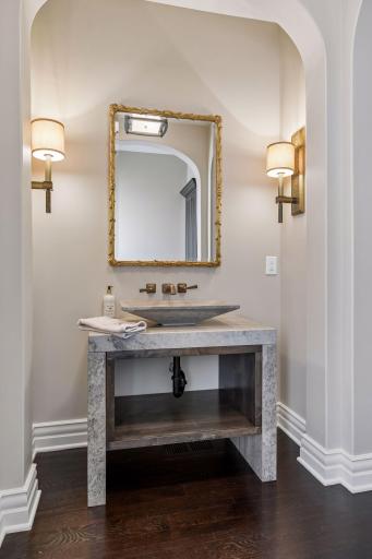 Main floor powder bathroom - gold trimmed mirror is excluded in the sale