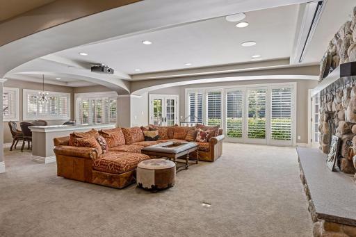 Lower level recreation room with wood burning fireplace