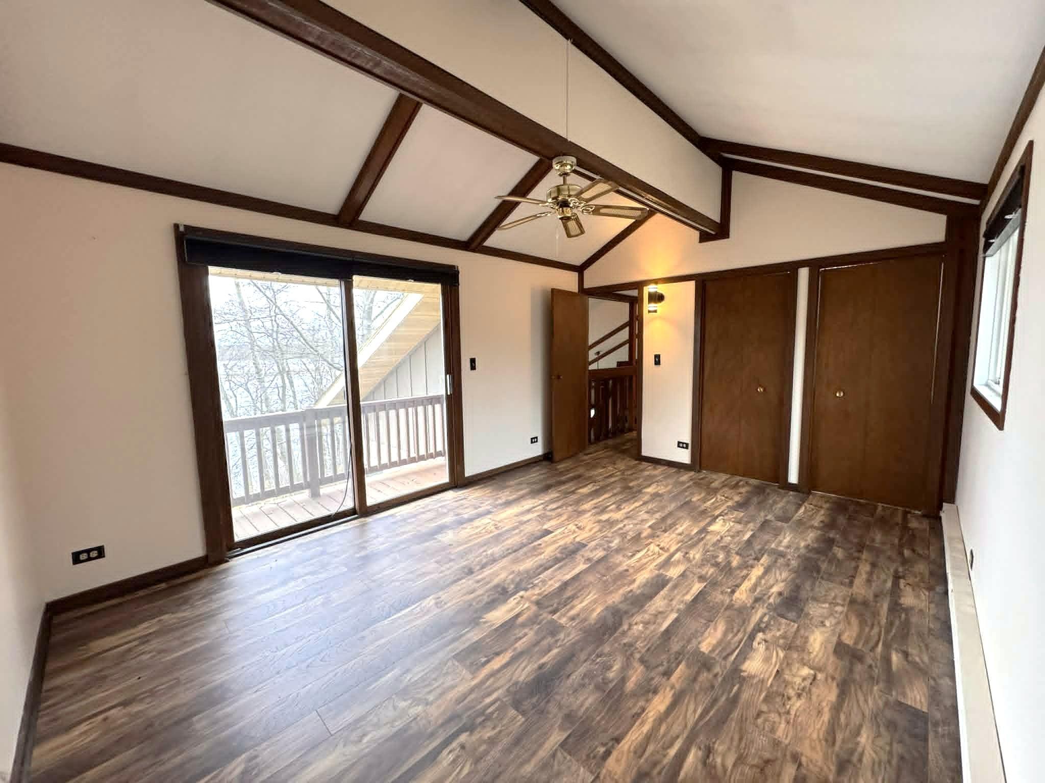 Primary bedroom with balcony and river view.jpg