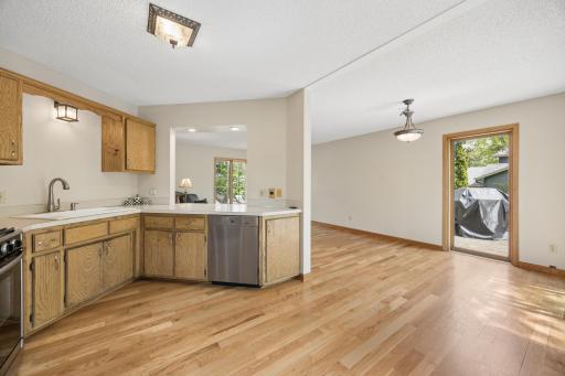 Open sightlines connect the kitchen and dining spaces, creating a functional layout ideal for both daily living and entertaining guests.