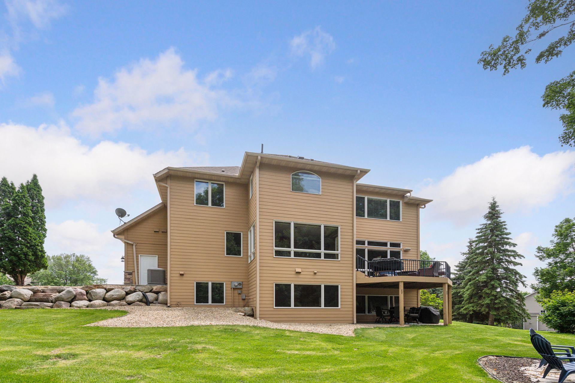 Windows, windows and more windows bring a ton of natural light inside! Outdoor spaces offer perfect entertaining - deck, under deck patio and firepit. The stone landscaping that surrounds this lot is amazing!