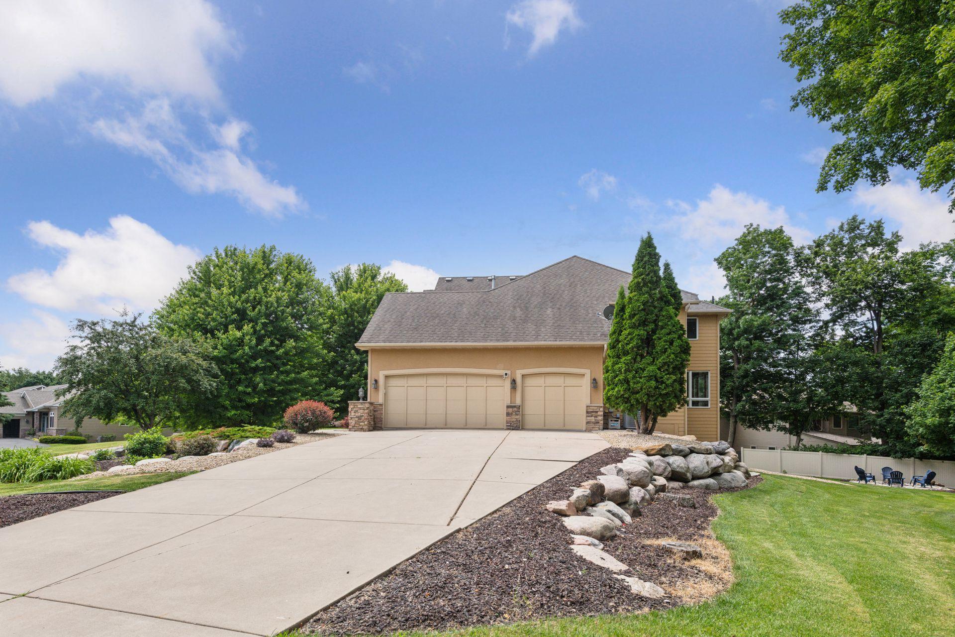 No shortage of parking! Large, upgraded concrete driveway offers an ton of space for extra parking, entertaining guests, multi-generational living, and more! Beautifully stone landscaping surrounds this home!