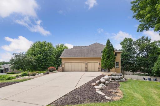 No shortage of parking! Large, upgraded concrete driveway offers an ton of space for extra parking, entertaining guests, multi-generational living, and more! Beautifully stone landscaping surrounds this home!