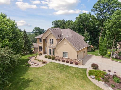 Spectacular corner lot offers wonderful privacy, long concrete driveway for extra parking, beautiful stone landscaping, great outdoor spaces - patio, firepit, and deck!