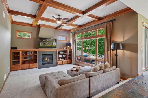 Exceptional craftsmanship shines throughout with custom built-ins, soaring ceilings, stunning wood beams, and dramatic floor-to-ceiling windows that fill the home with natural light.
