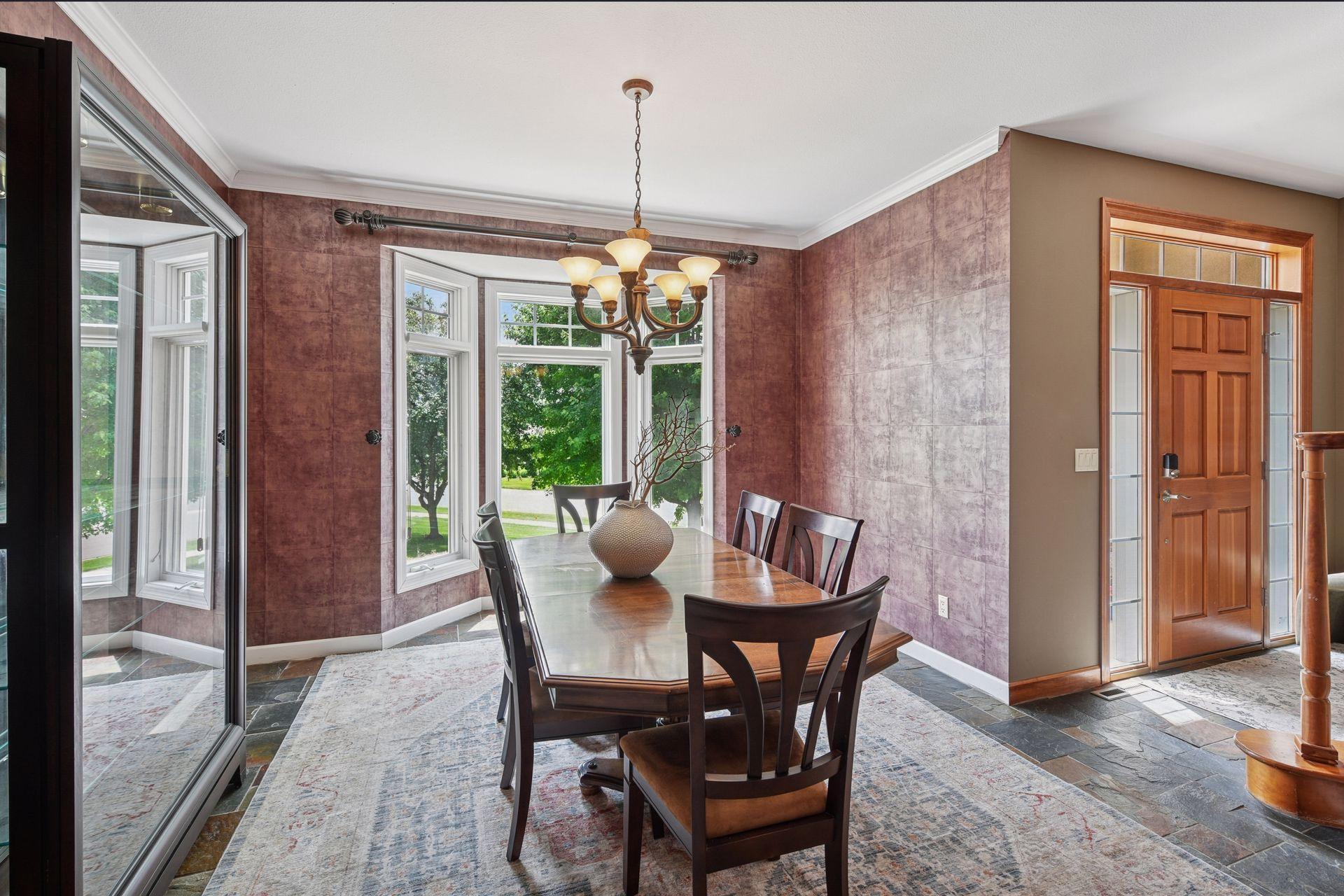 Rich finishes, oversized bay windows, and beautiful natural light create a warm and inviting atmosphere. Crown molding, beautiful tiled flooring, huge windows bring in a ton of natural light. Stylish and elegant design to make it all your own.