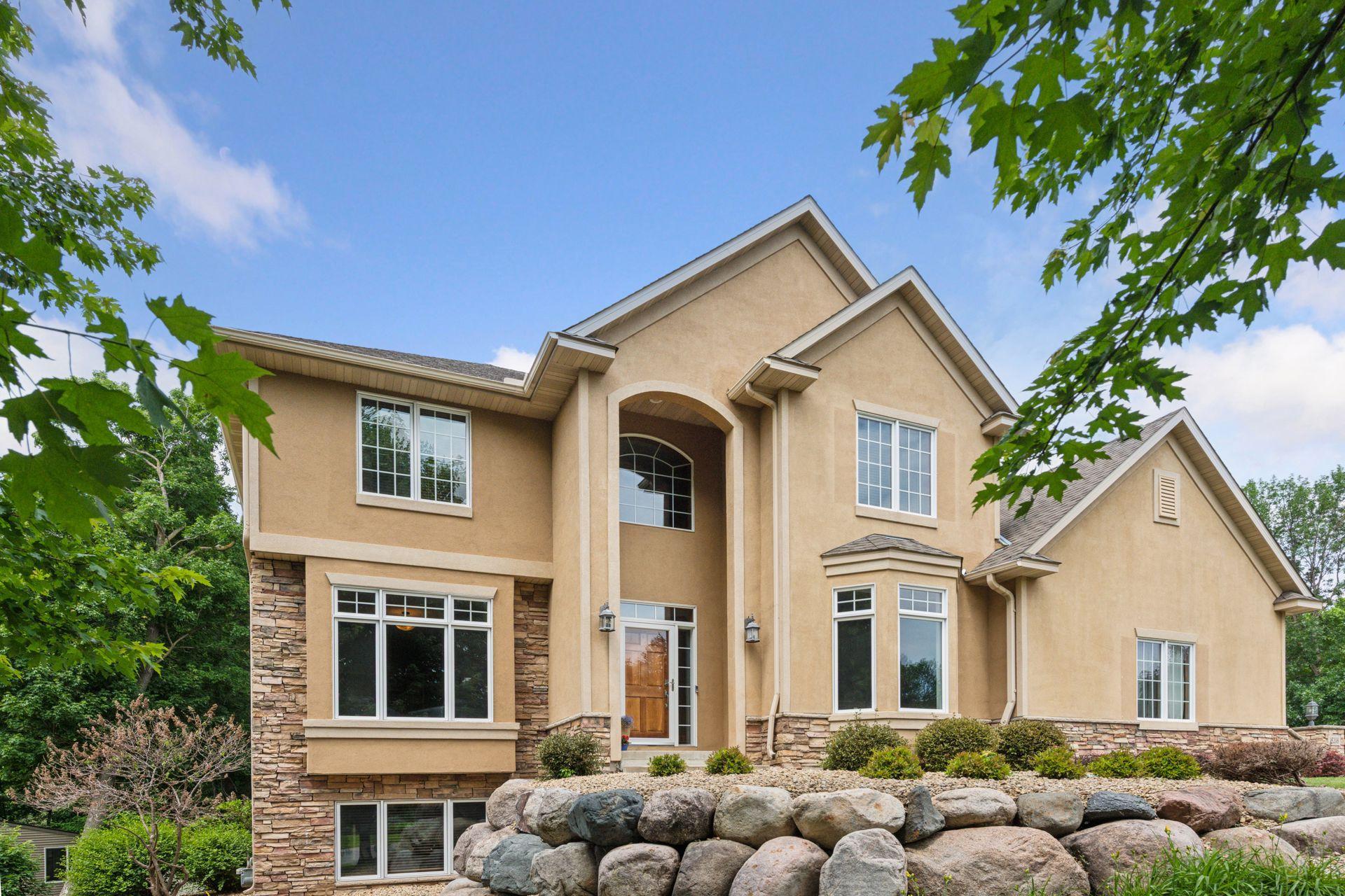 Custom built two-story offering timeless natural woodwork, rich wood detailing, and expansive gathering spaces in one of Prior Lake’s most established executive neighborhoods, The Wilds!