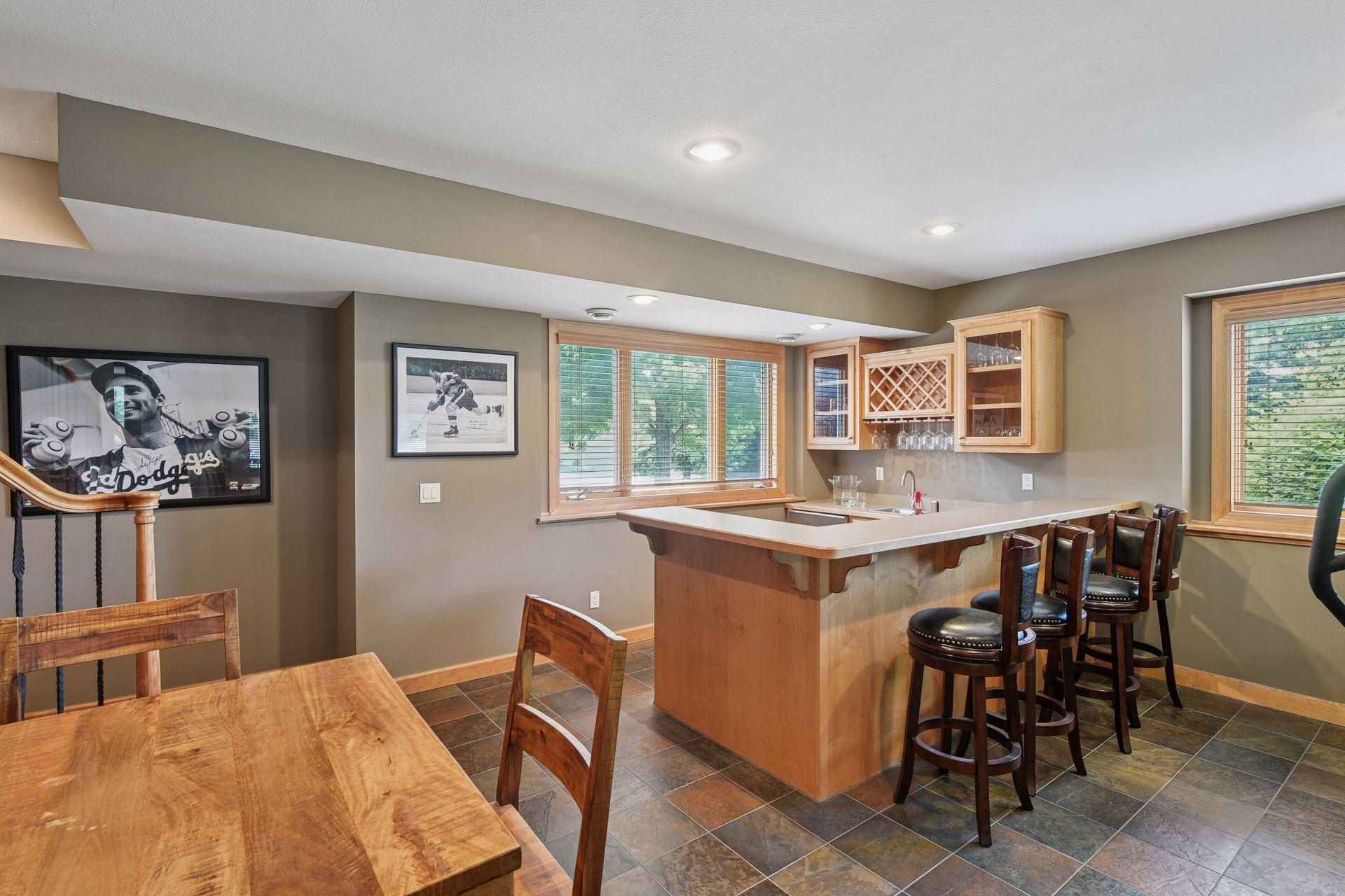 Warm wood finishes and thoughtful craftsmanship create an inviting pub-style atmosphere perfect for entertaining.
