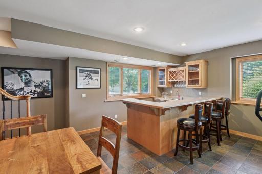 Warm wood finishes and thoughtful craftsmanship create an inviting pub-style atmosphere perfect for entertaining.