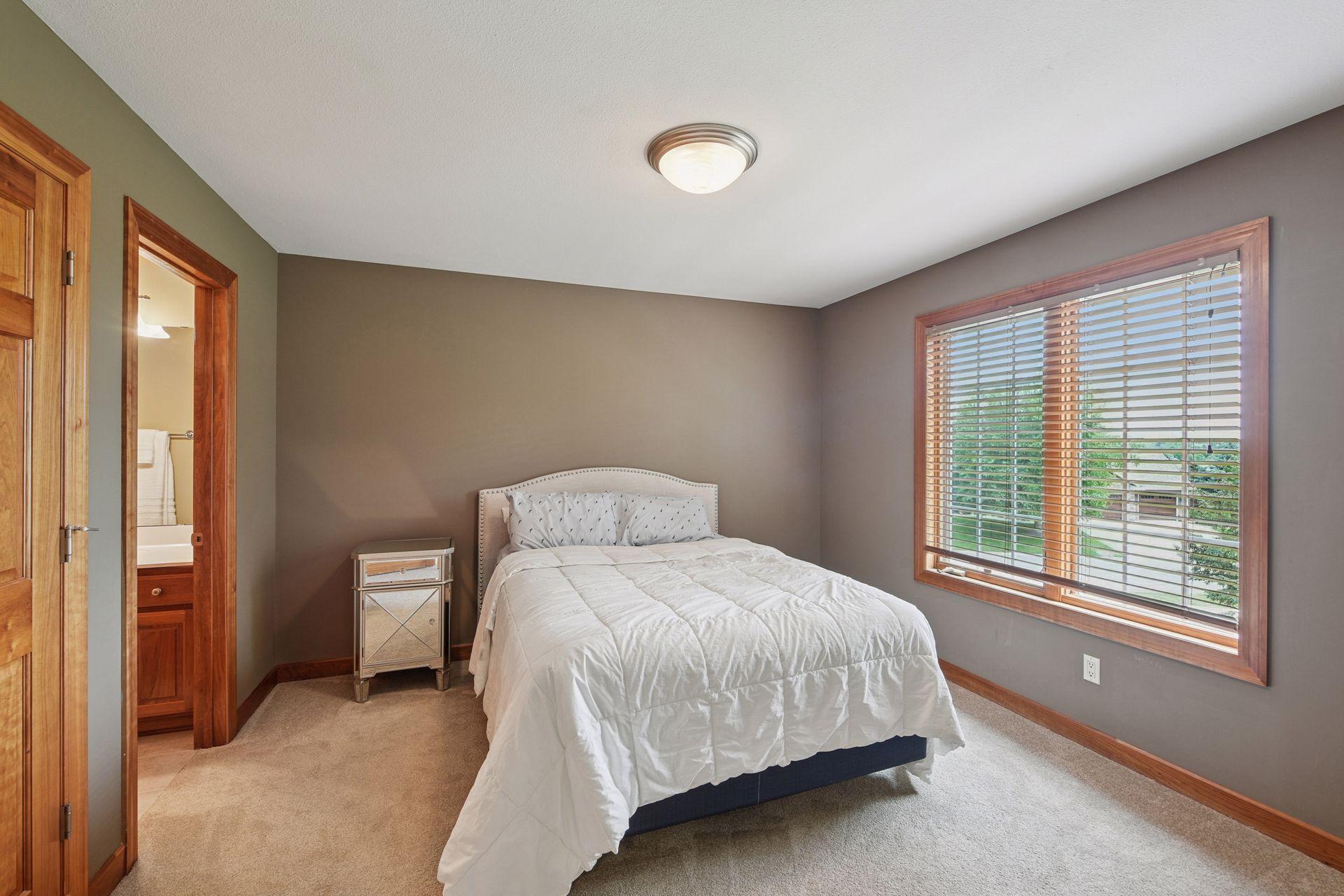 Neutral colors, flooring and large windows throughout.