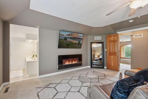 After a long day, retreat and relax in your amazing, primary retreat welcoming you with French doors, primary suite bathroom, cozy fireplace!