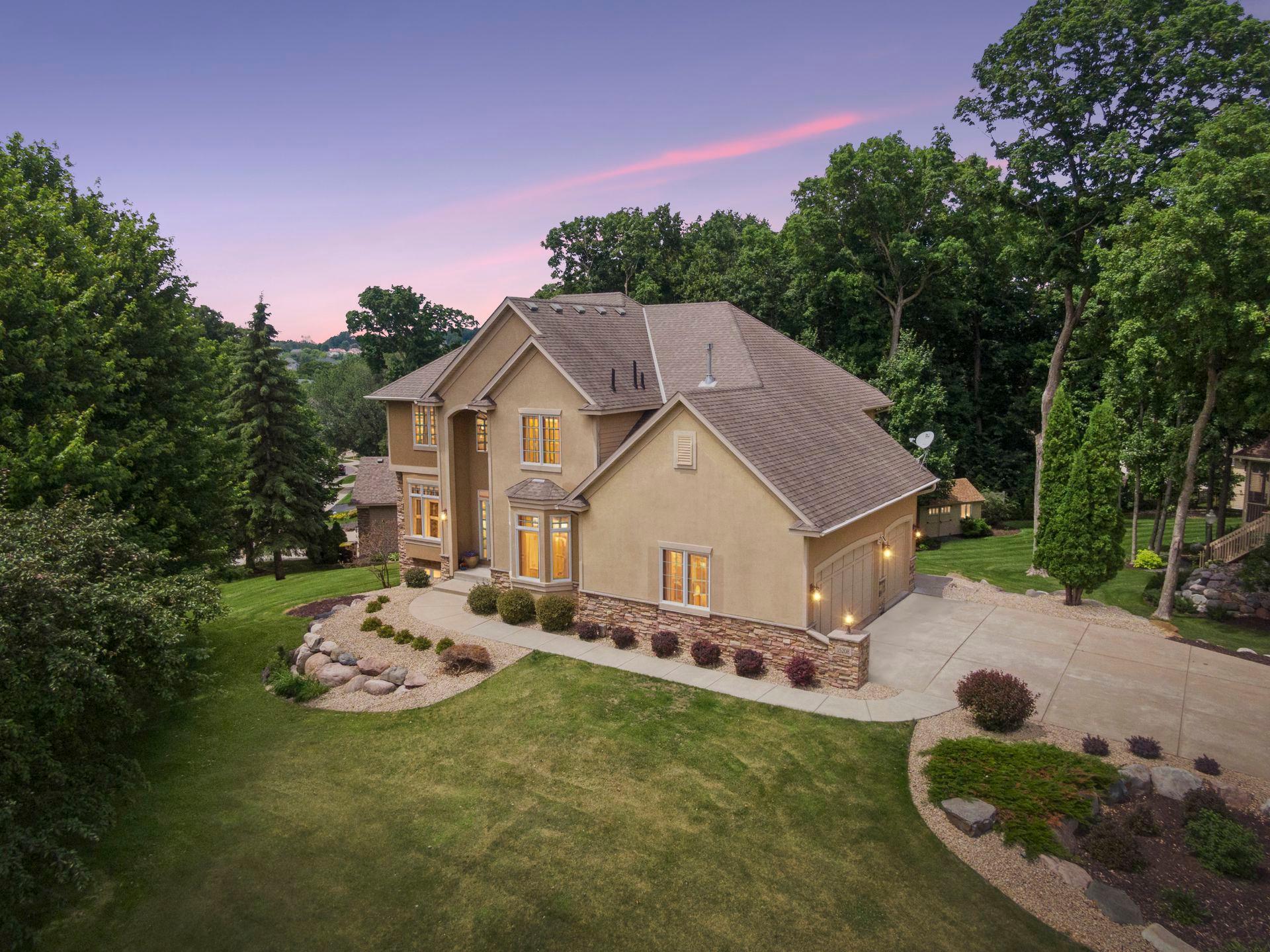 Custom two-story built to impress on exceptional corner lot. Custom-crafted two-story offering timeless natural woodwork, rich wood detailing, and expansive gathering spaces in one of Prior Lake’s most established executive neighborhoods, The Wilds!