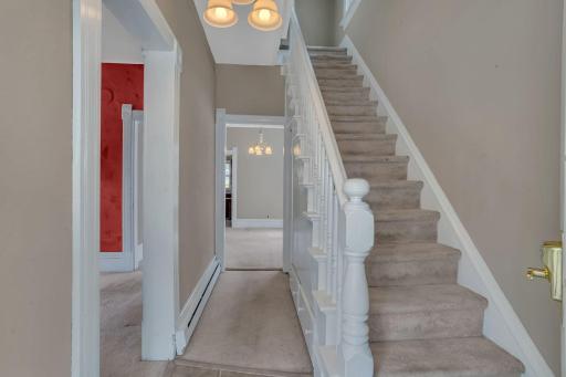Right off the main front door is the staircase leading to the upper floor