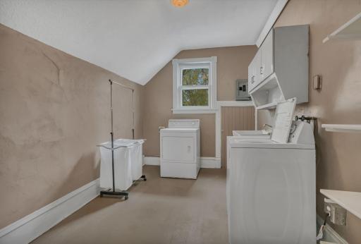The upper floor laundry room is convenient and large. Once used as a kitchen - it has multiple uses.