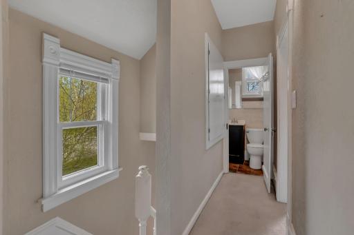 An upper floor bathroom - and hallway linen closet