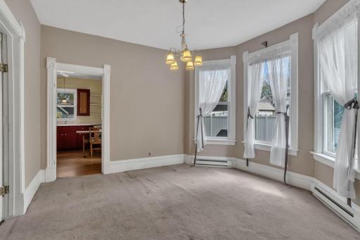 The formal dining area with its south facing coved window area is bright and large.