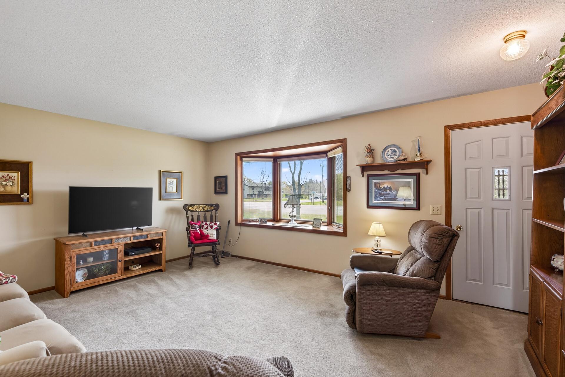 spacious main floor living room with bay window