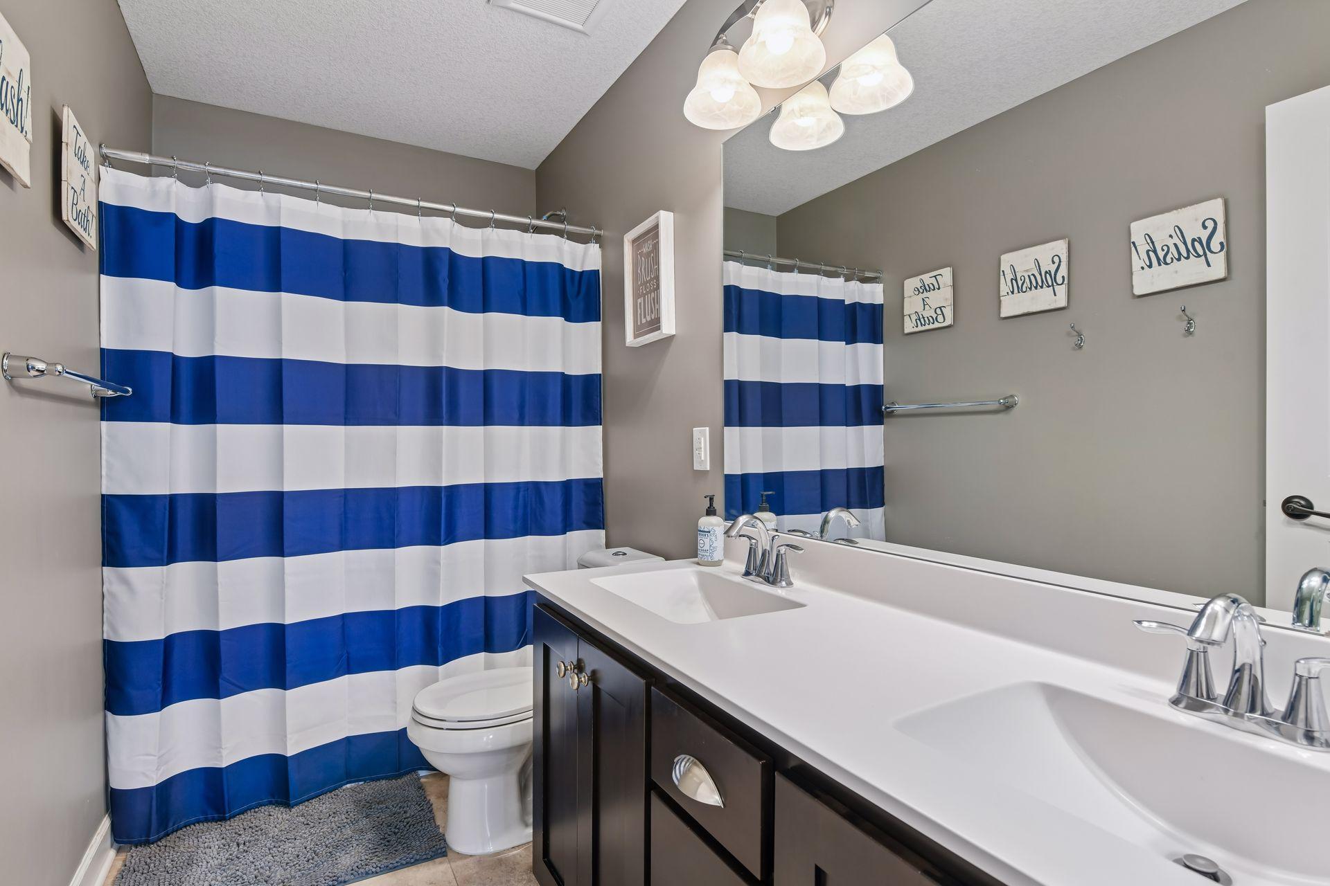 Upper level hall bath boasts a dual-sink vanity