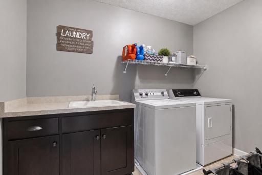 Convenient laundry room located on the upper level