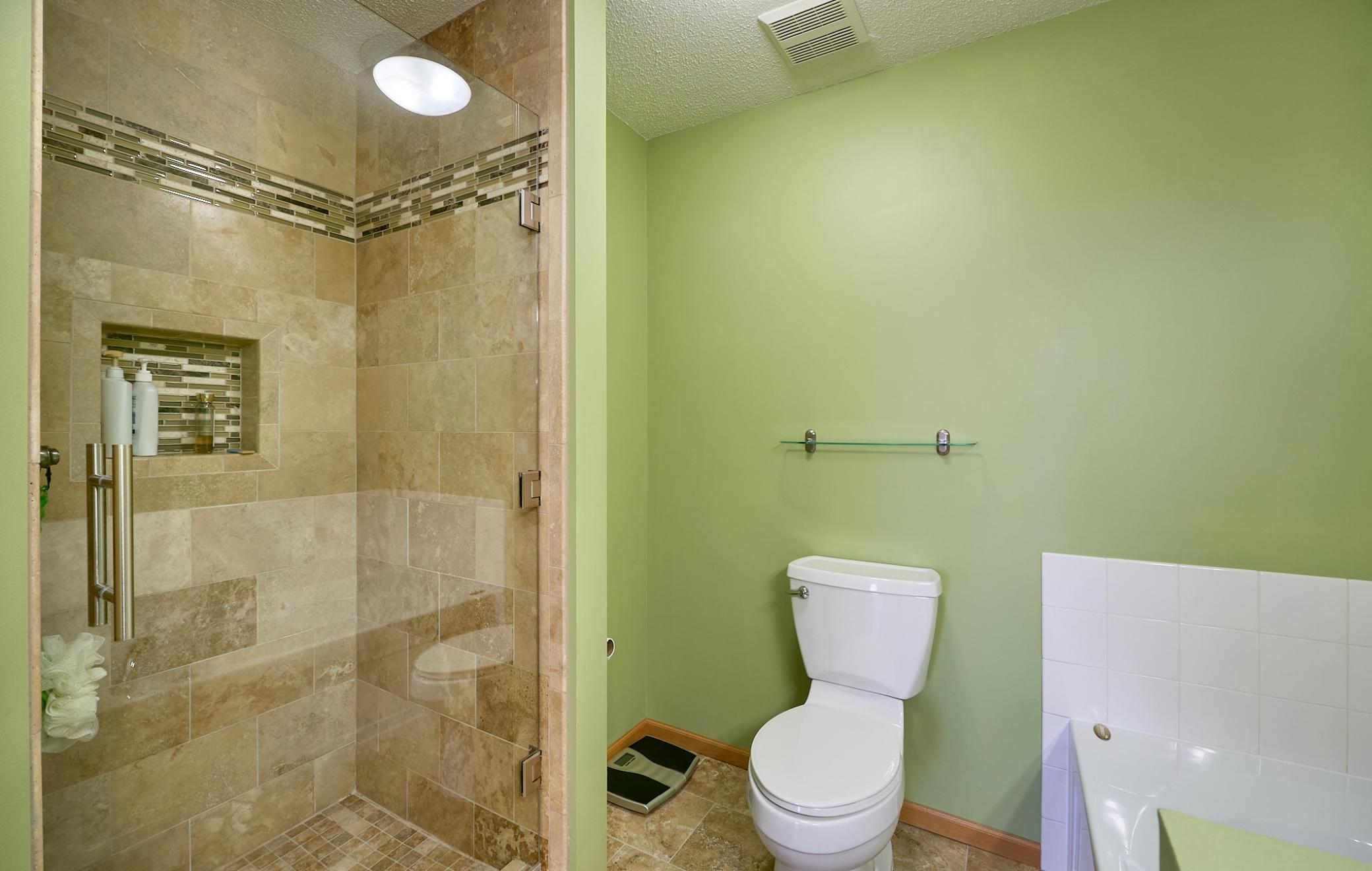 Owner's full bath with custom tile shower
