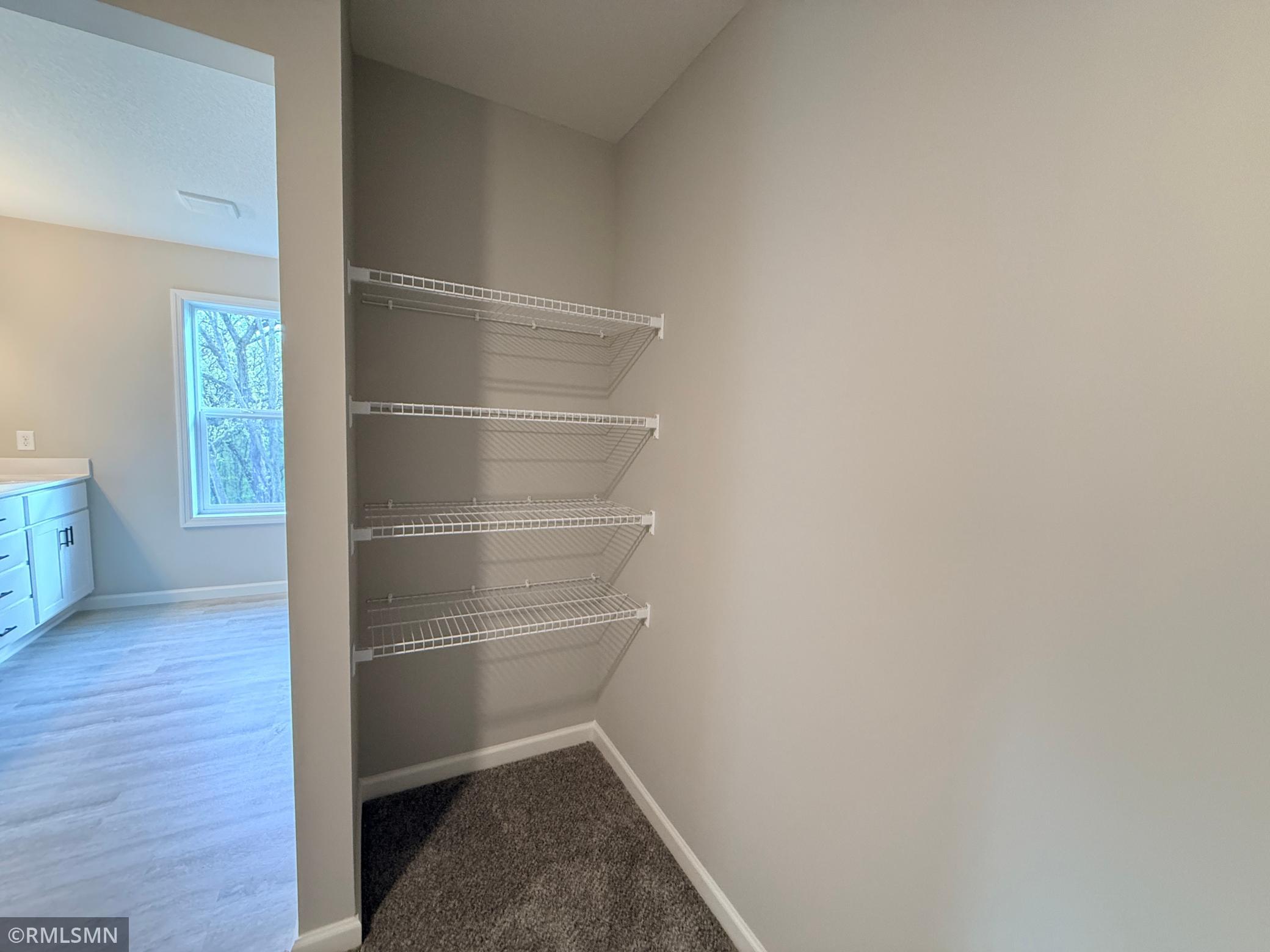 Owner's suite closet shelving