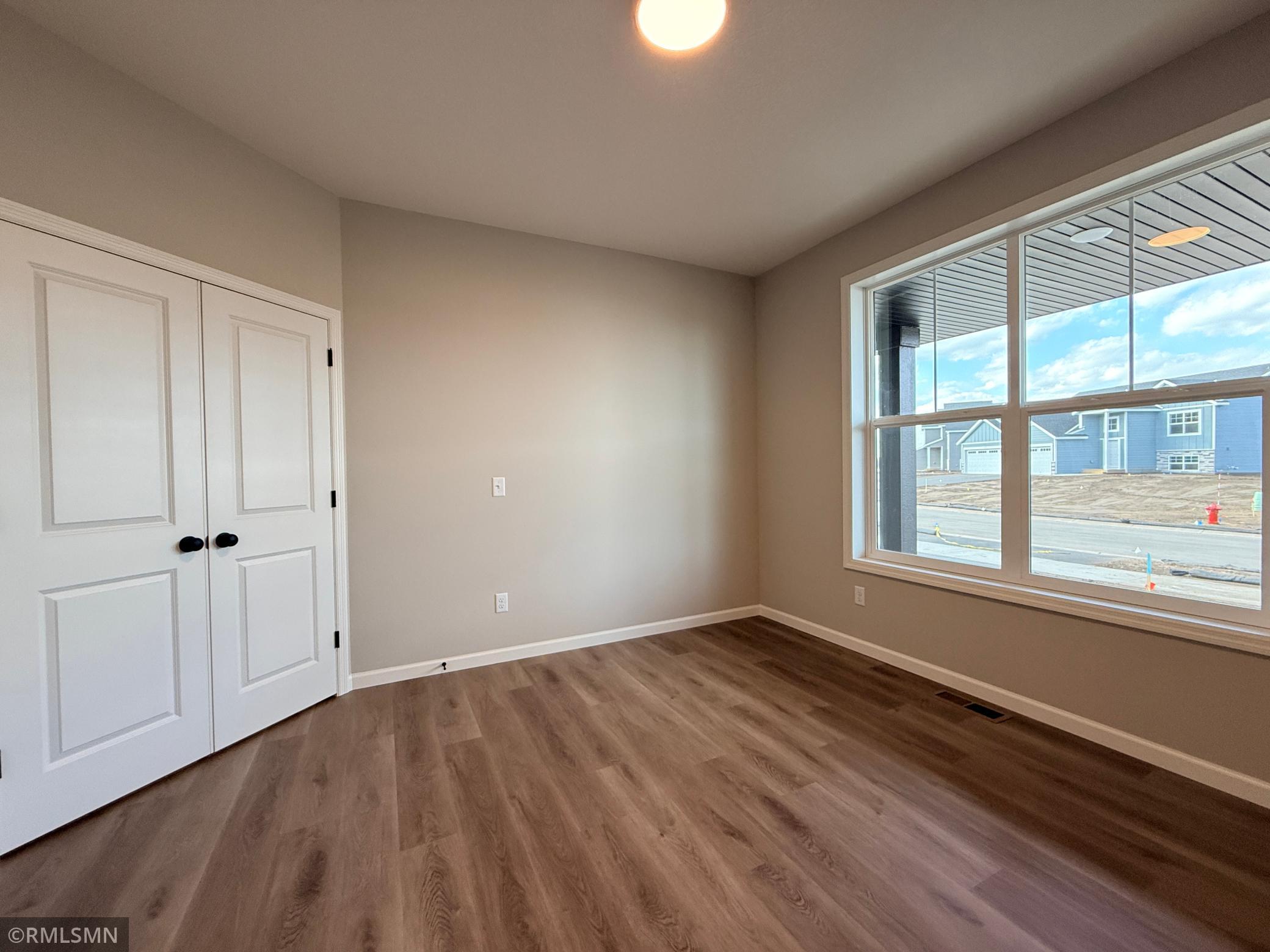 This main floor flex room has double doors and would work equally well as an office, a playroom, gaming room, or hobby space