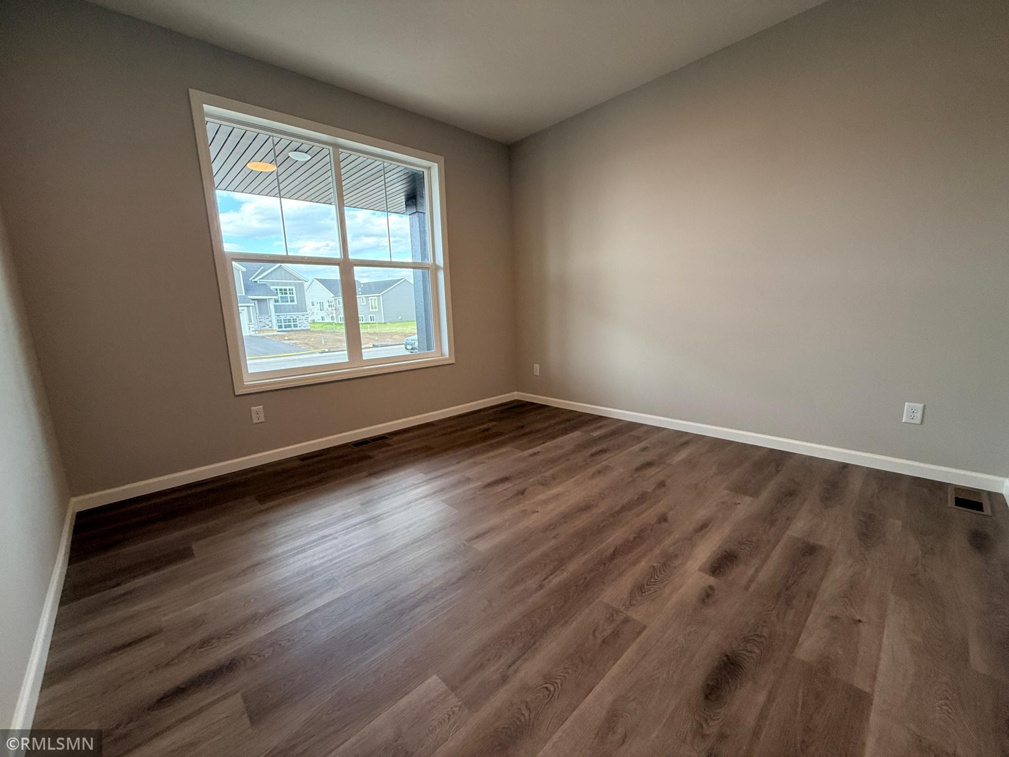 This main floor flex room has double doors and would work equally well as an office, a playroom, gaming room, or hobby space