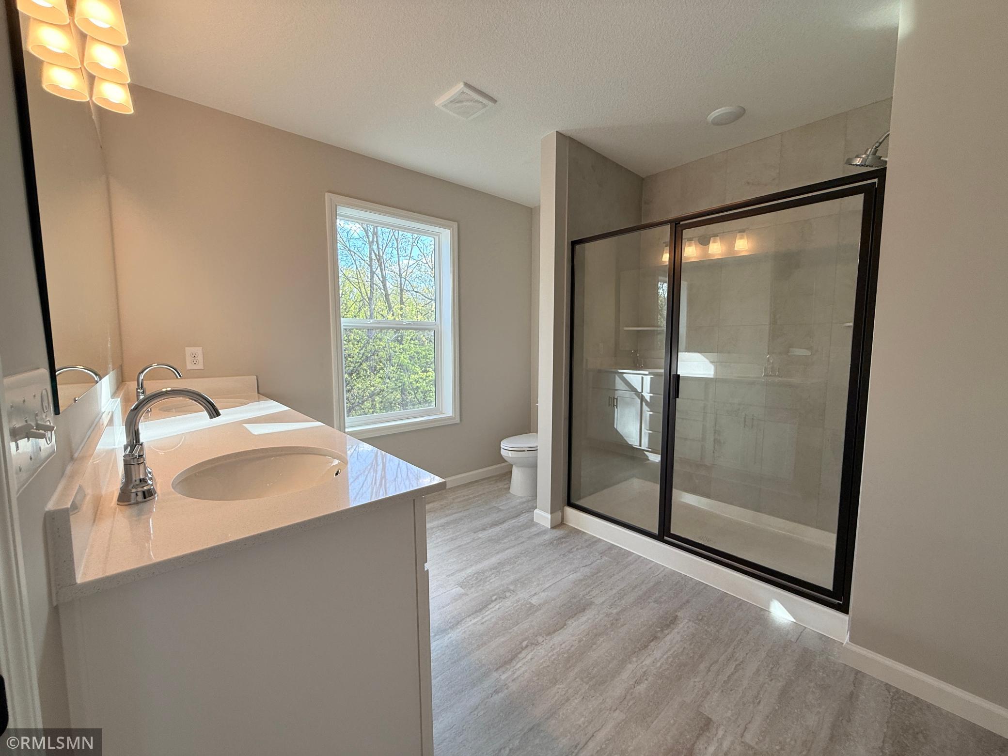 The owner's suite bathroom is roomy and luxurious!