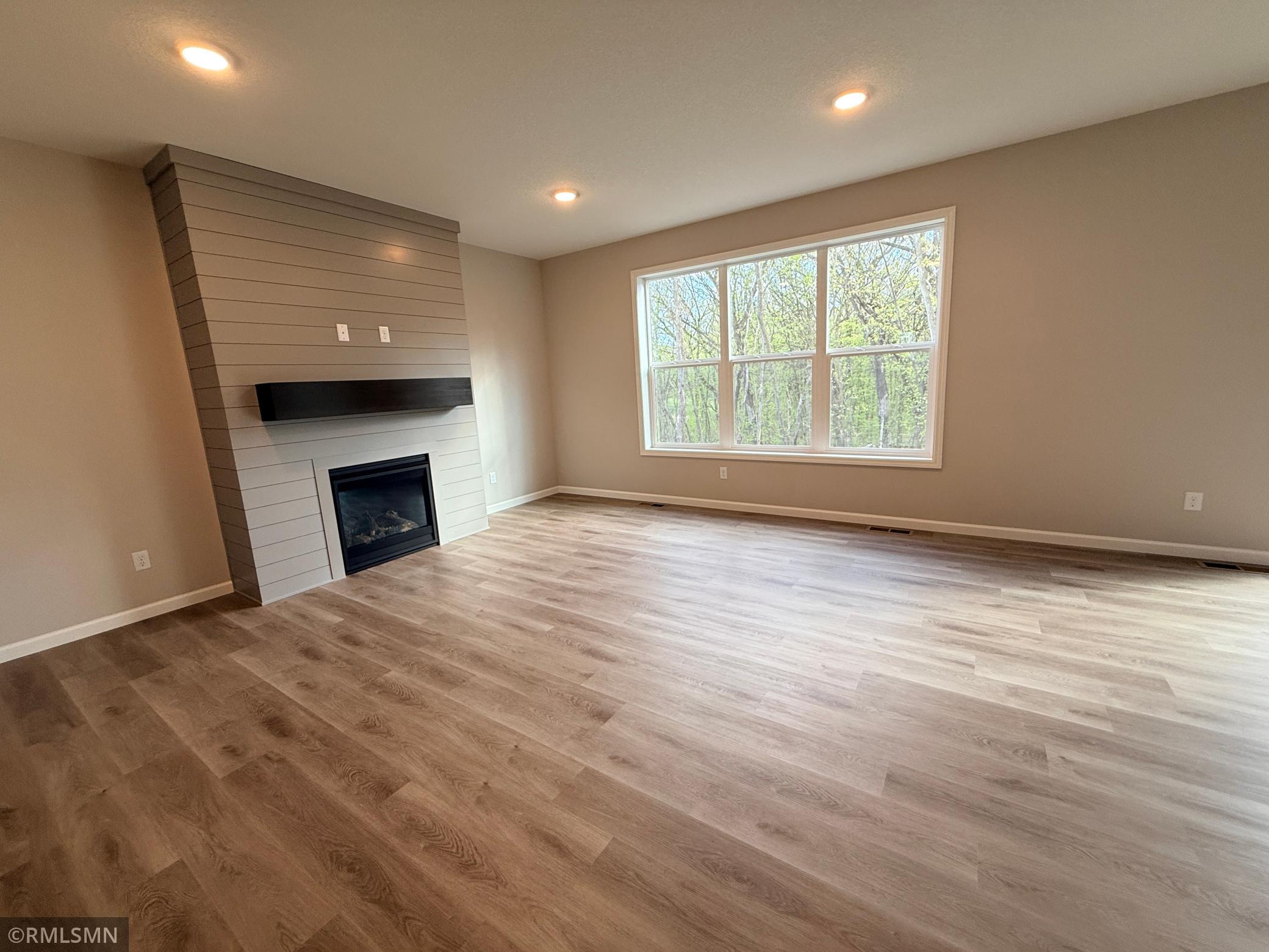 The main floor open space flows seamlessly with this warm luxury vinyl plank flooring