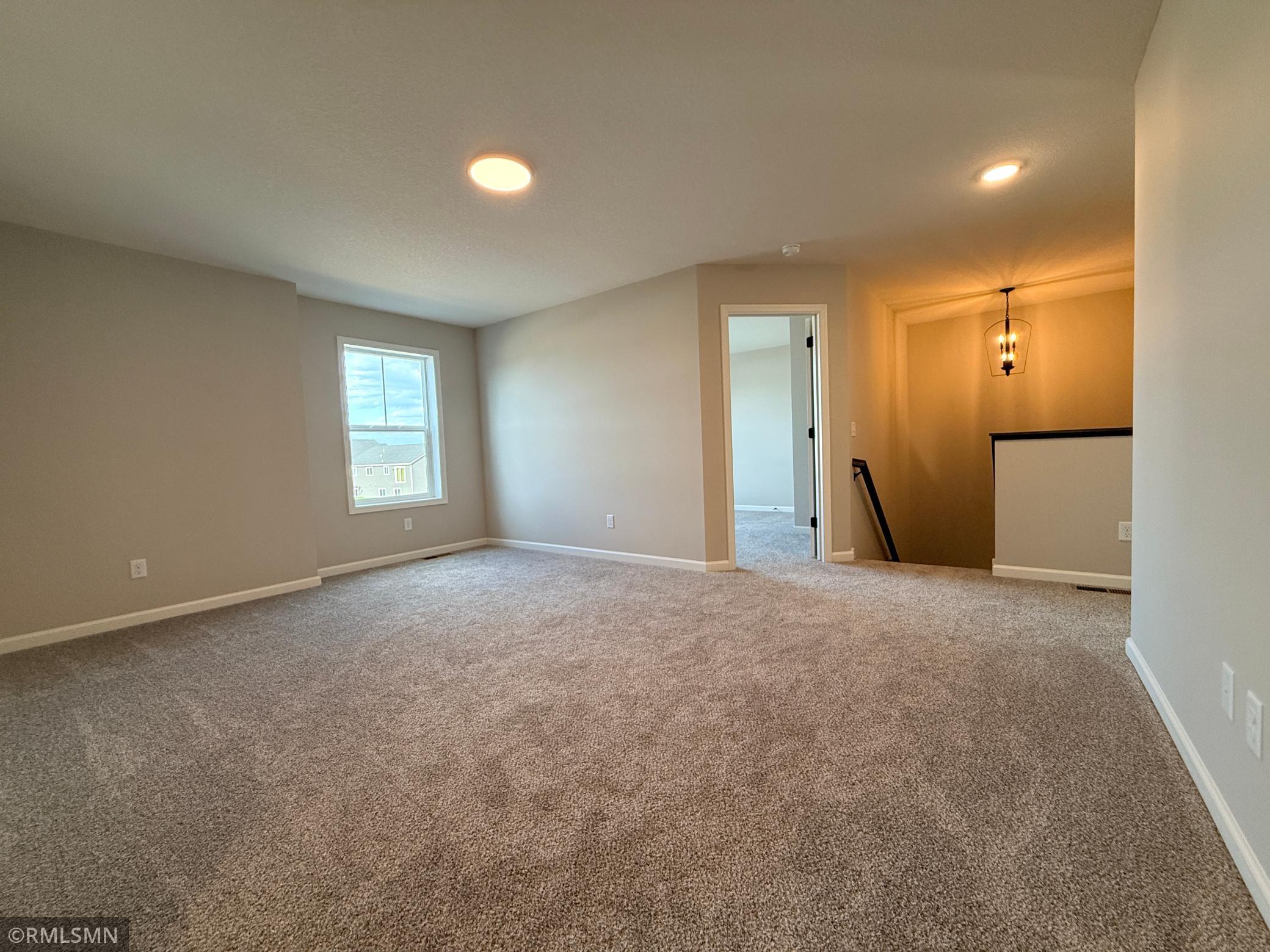The spacious loft at the top of the stairs adds yet another gathering space, perfect for an extra tv room, morning area, or play room